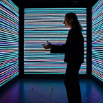 시간 기반 예술 작품의 인터넷 플랫폼 활용 - Interactive Art Installation**

"A fully clothed woman in stylish, modest clothing stands in a darke...